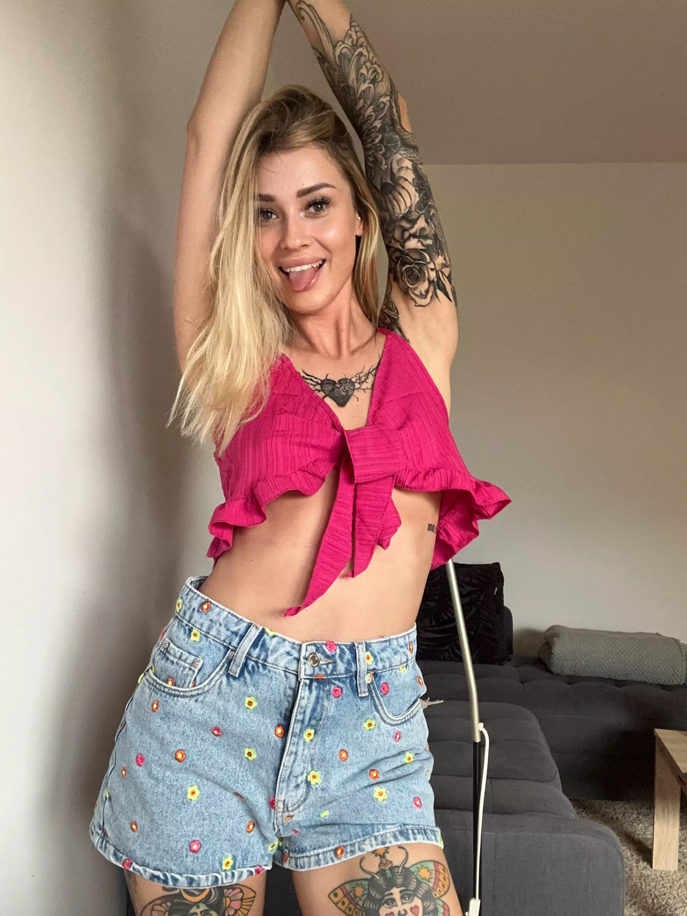 A cheerful, tattooed, petite blonde. 