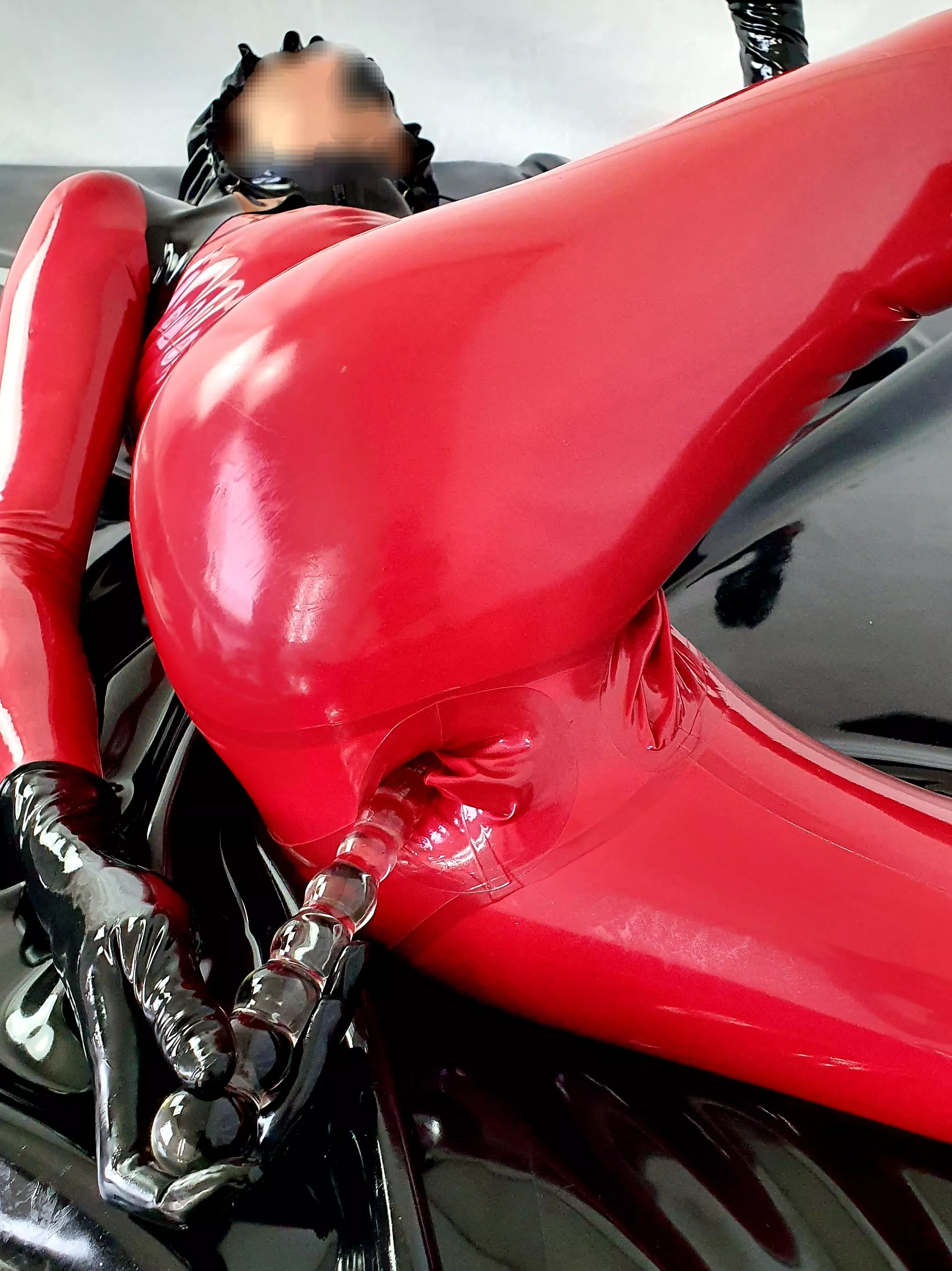 Anal-only play in one of my many latex catsuits with integrated vaginal and anal condoms!