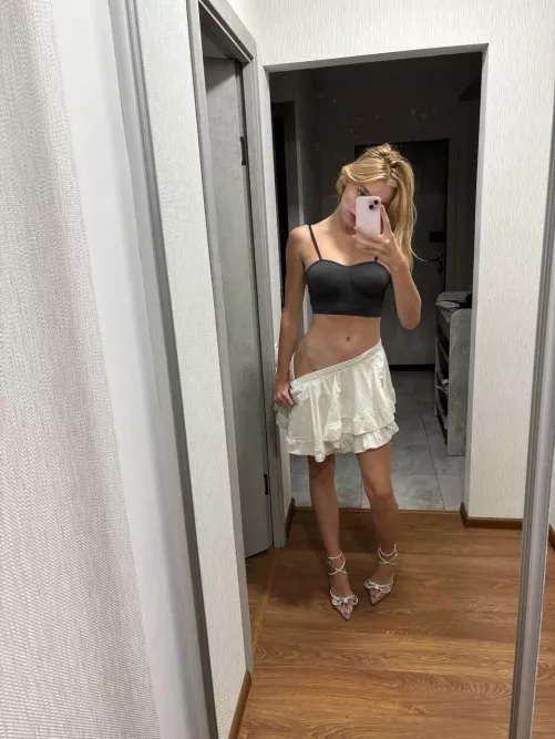 The cute blonde looks tantalizing even dressed up