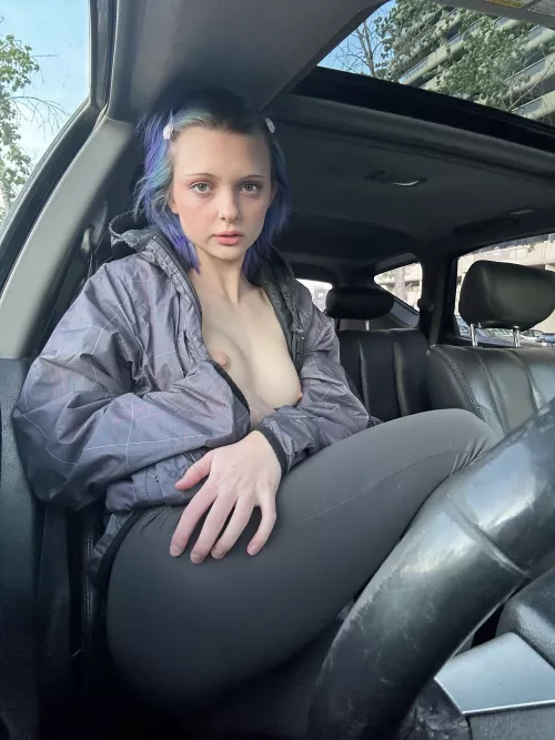 Sitting in the car, I decided to show my boobs