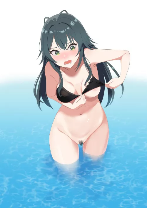 A big wave knocked her top out of place…and her bottoms are long gone