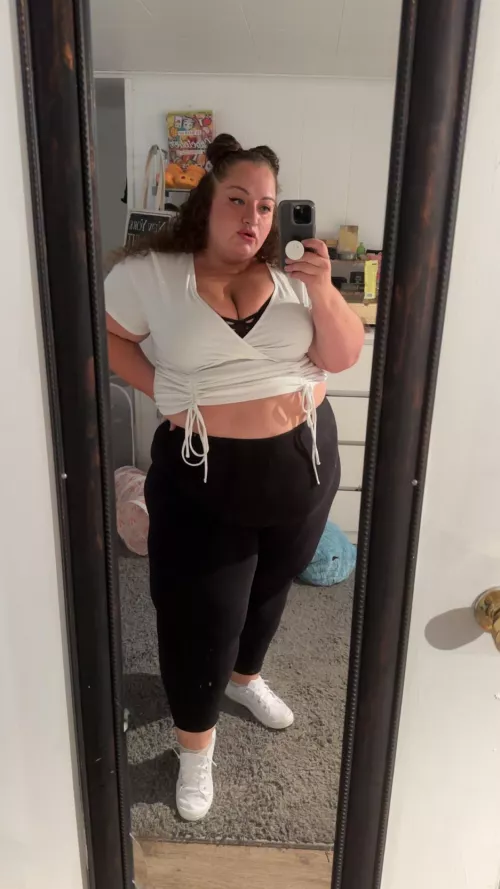 Space buns and a little white sneaker.