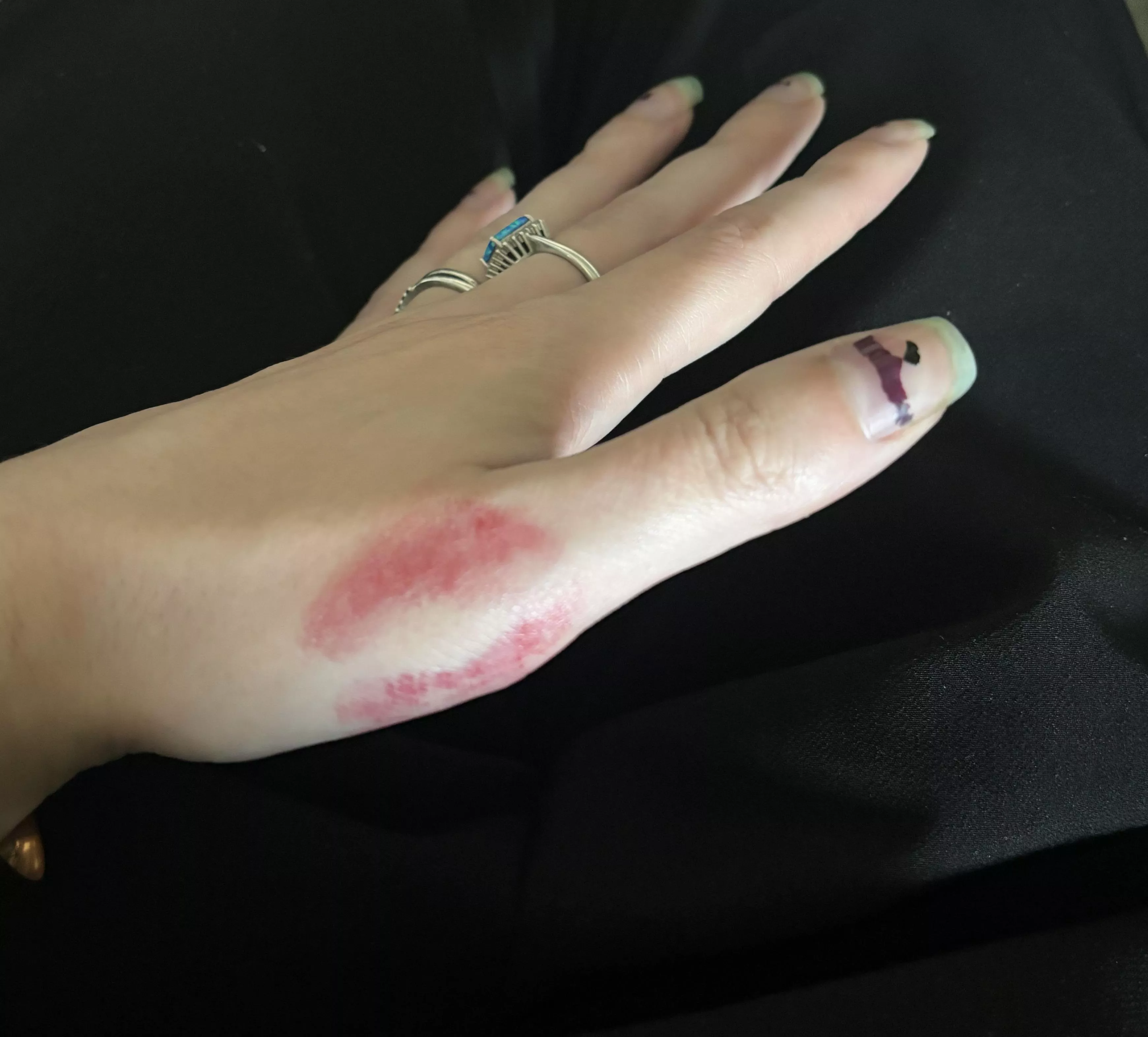 Hand with a lipstick kiss