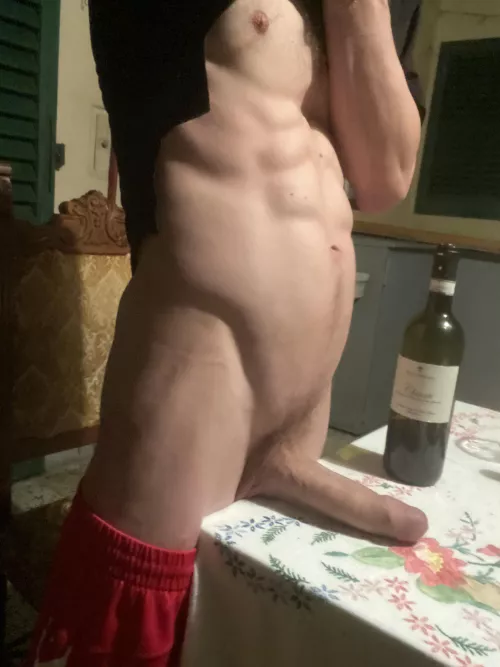 on the balcony with a bottle of wine 