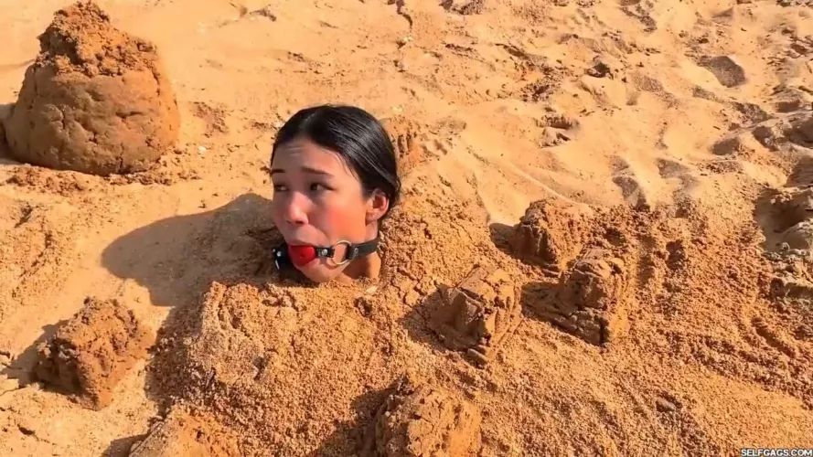 Does being buried in sand count as Outdoor Bondage?