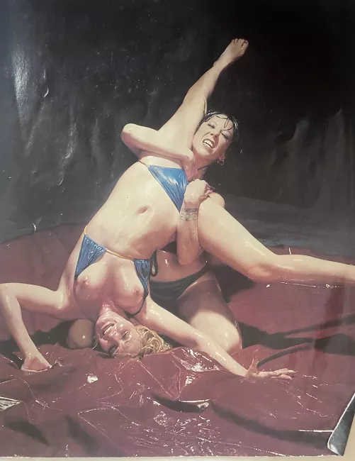 Annie Sprinkle oil wrestling with unknown adversary. 1970s?