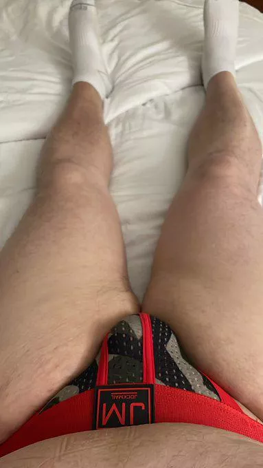 Relaxing in my hotel in nothing but my jock and socks