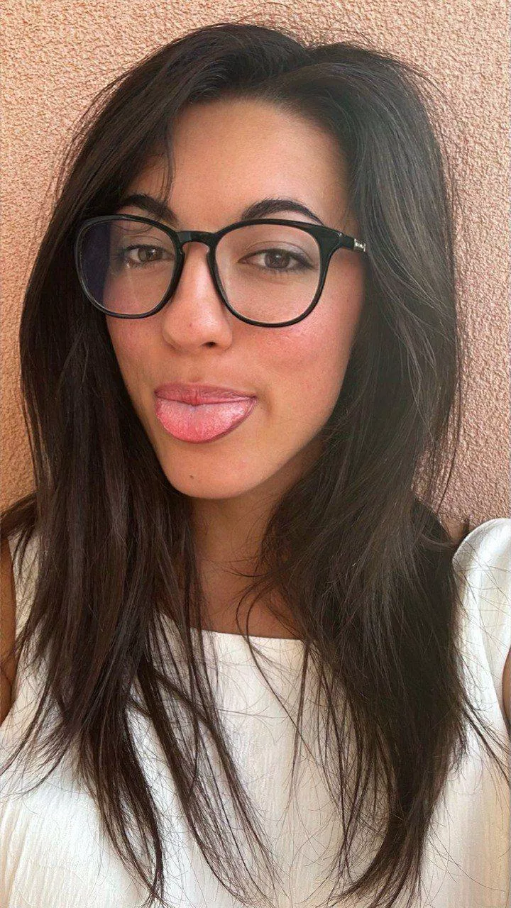glasses on, tongue teasing, want my playful-loving vibe babe