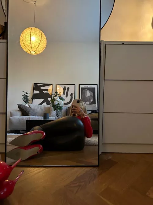 leather pants, and red heels a good combo.. with a red sexy shirt