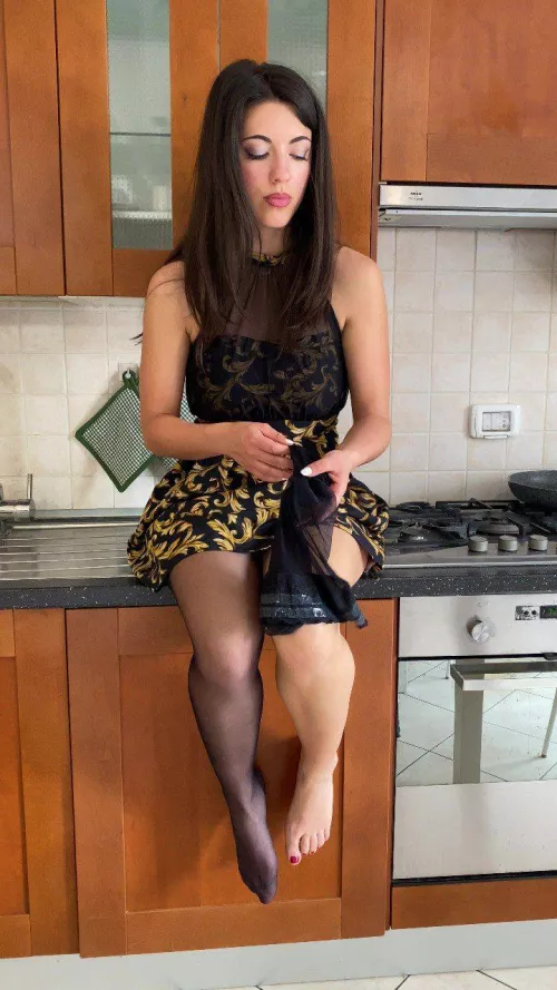 stockings in hand, waiting for your touch in the kitchen