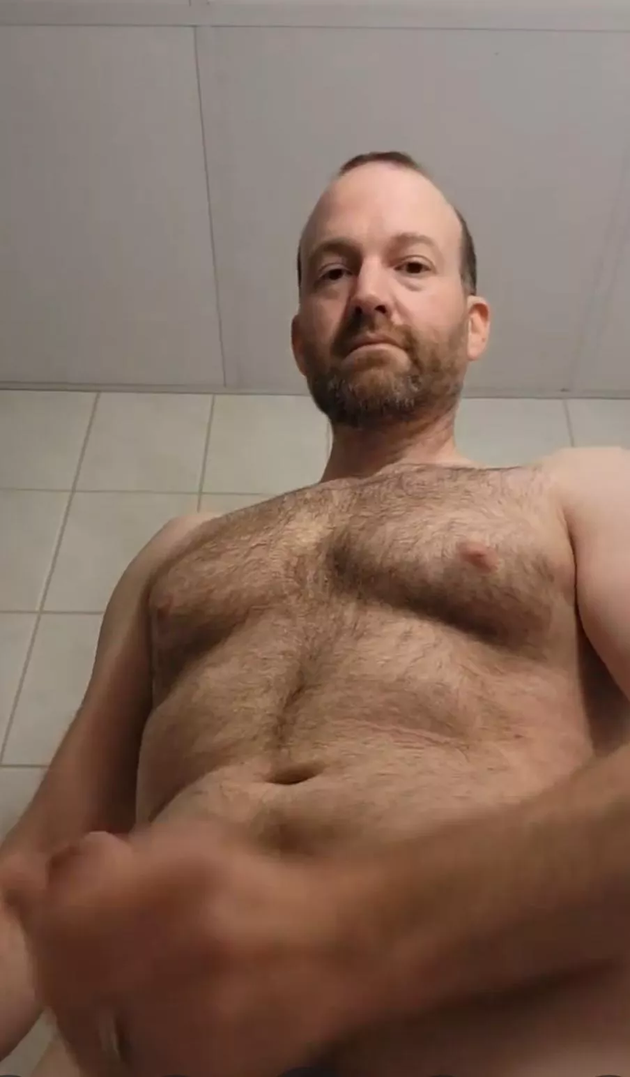 Focusing on the chest hair 