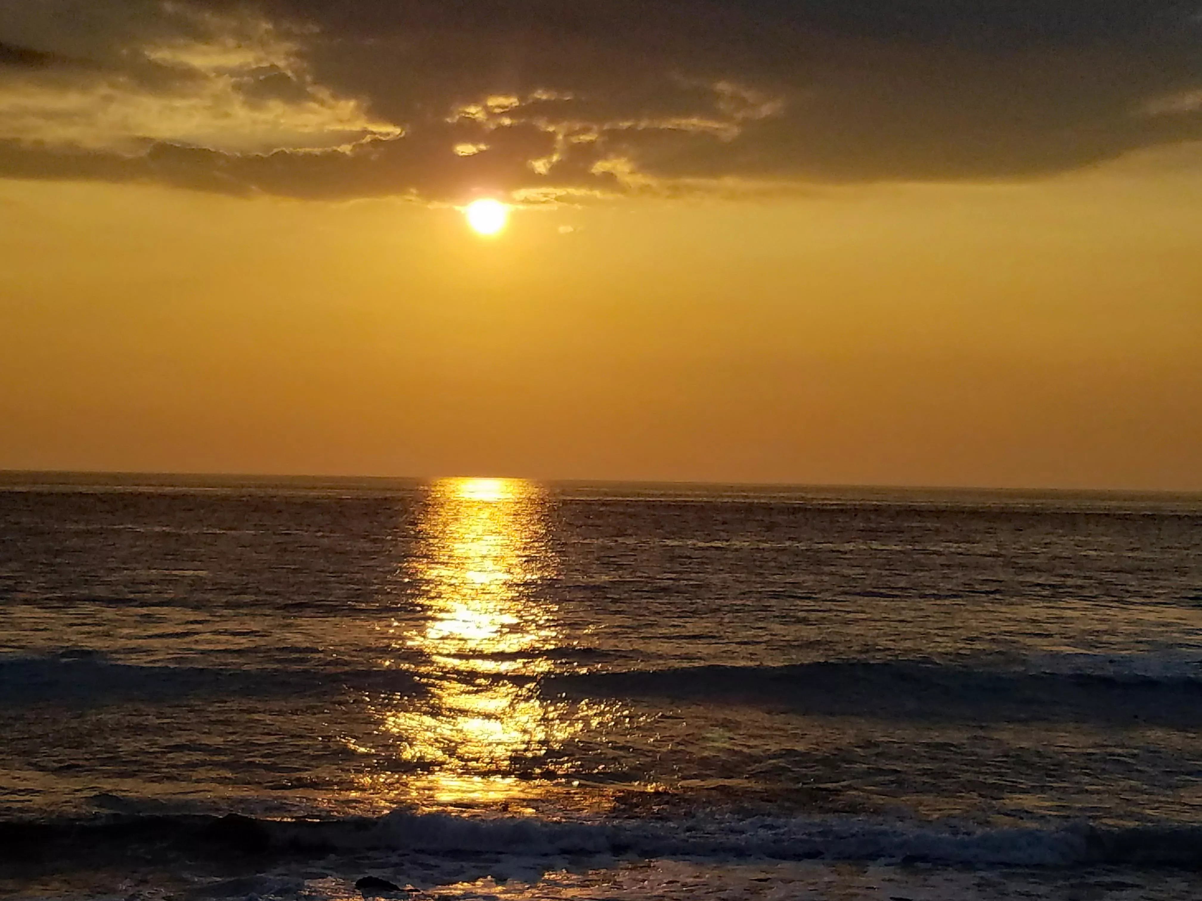 Sunset on a north shore beach on the big island of Hawaiʻi
