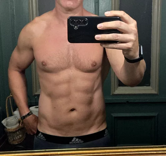 [48] your roommates Dad takes you both to the beach club for the day and looks like this and he keeps stealing glances at you...