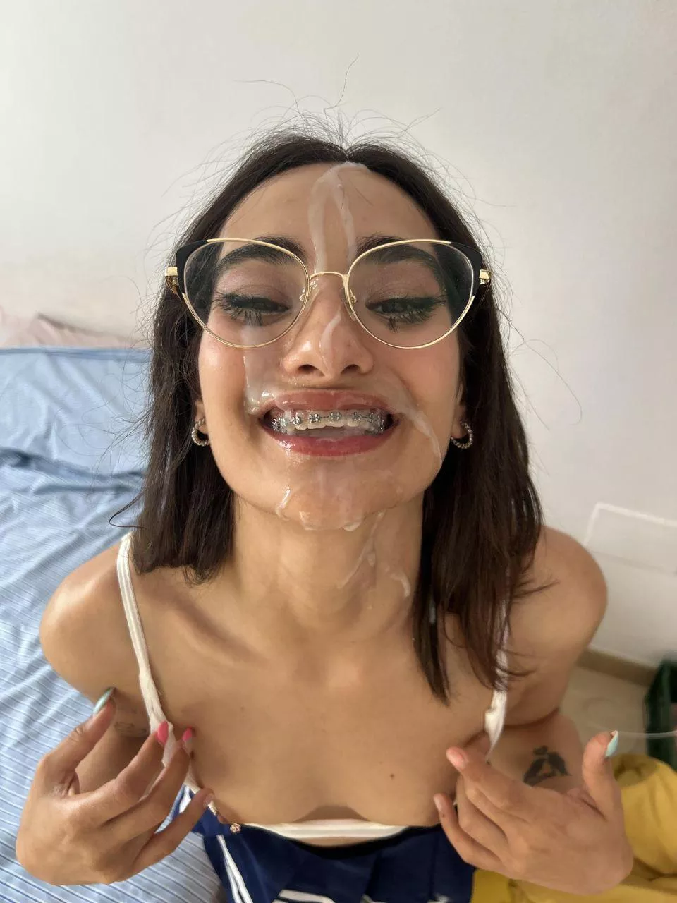 Cute braces facial. She is happy.