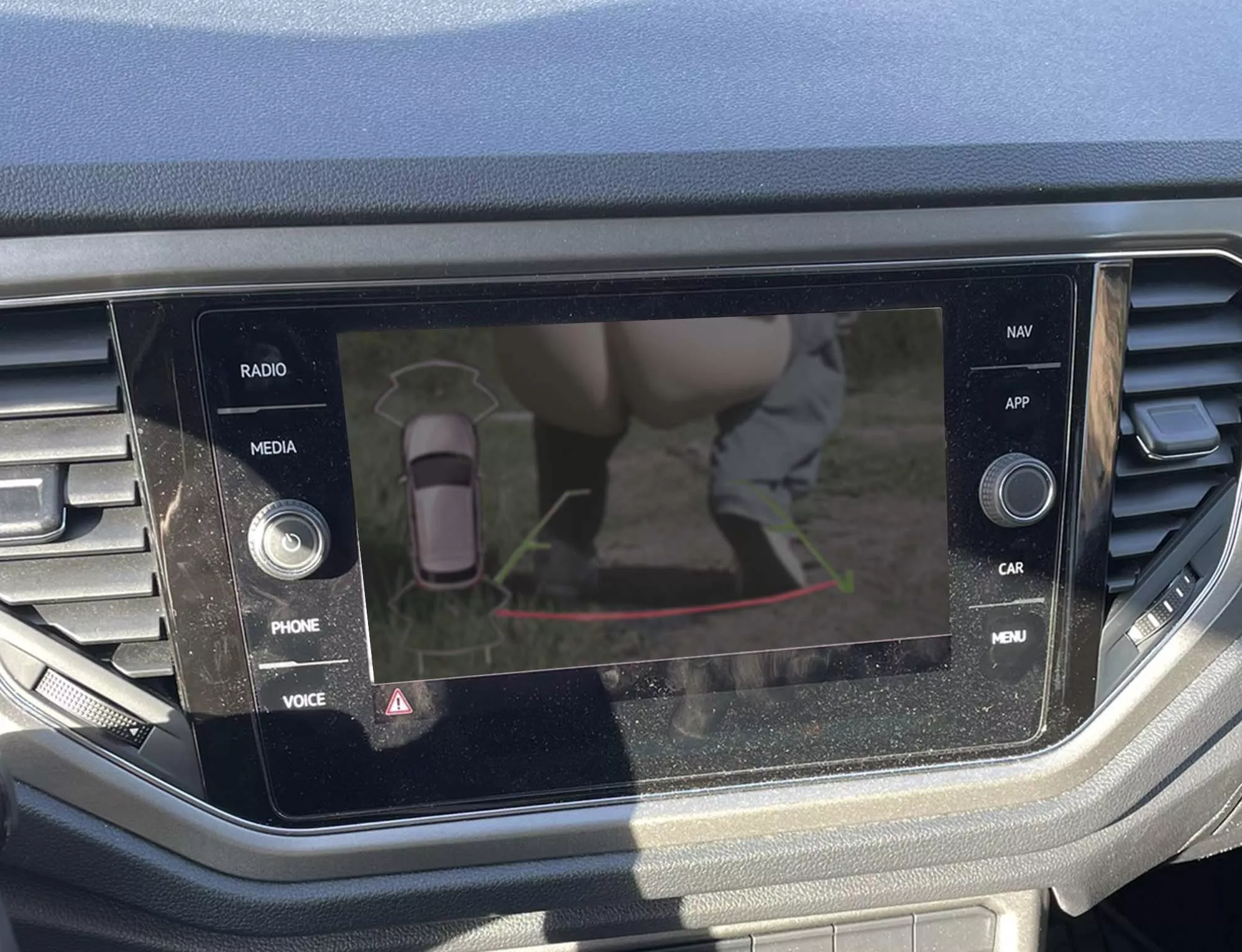 Just go behind the car, no one will see