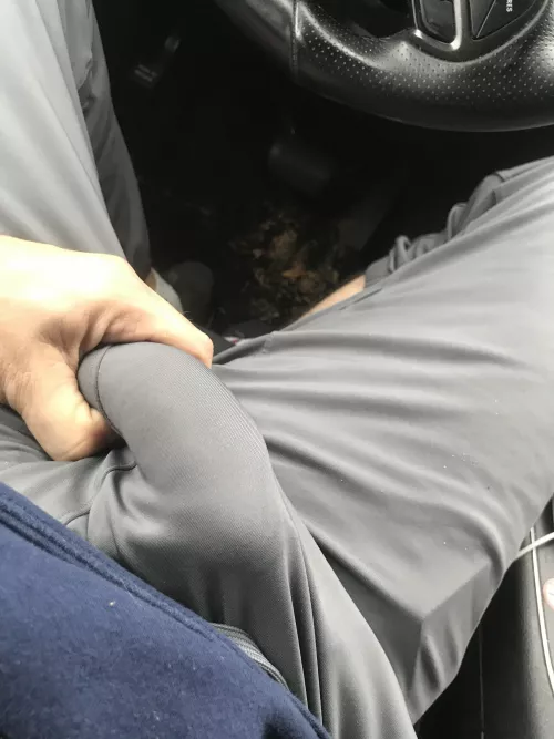 Bulging out of the gray sweatpants 