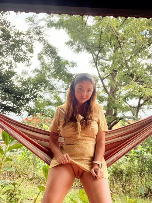 Red Fox flash her pussy in a hammock.