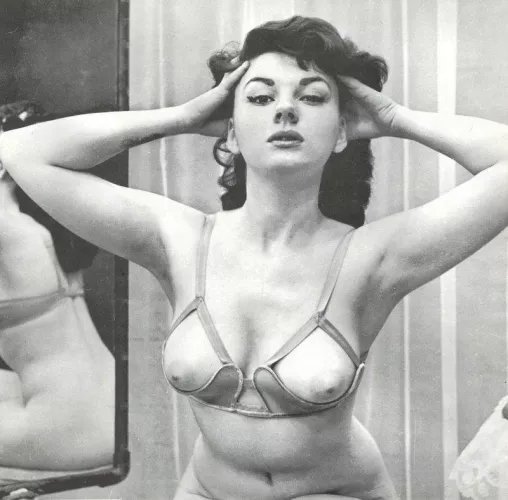 Glenda Graham tries on her special bra [1961]