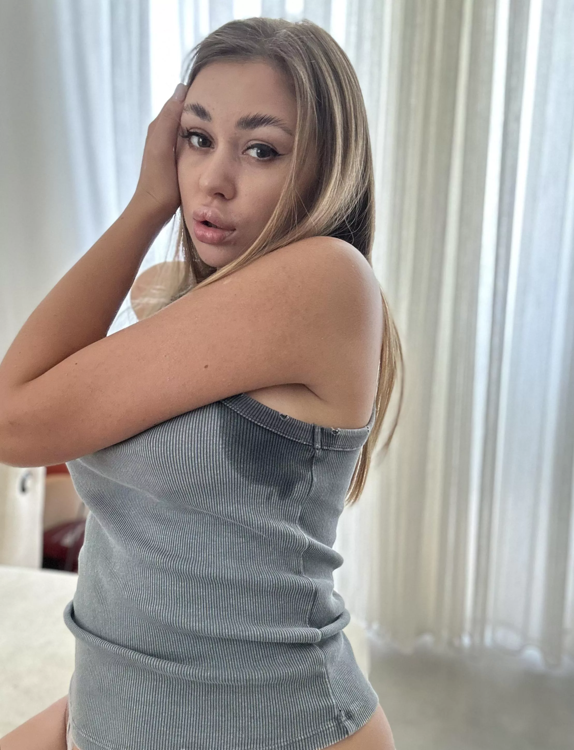 sweating because it's so hot in the room