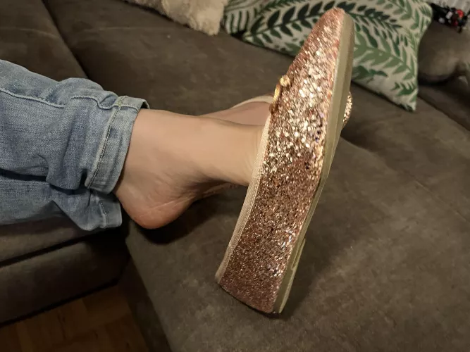 Glittering flats dangle 