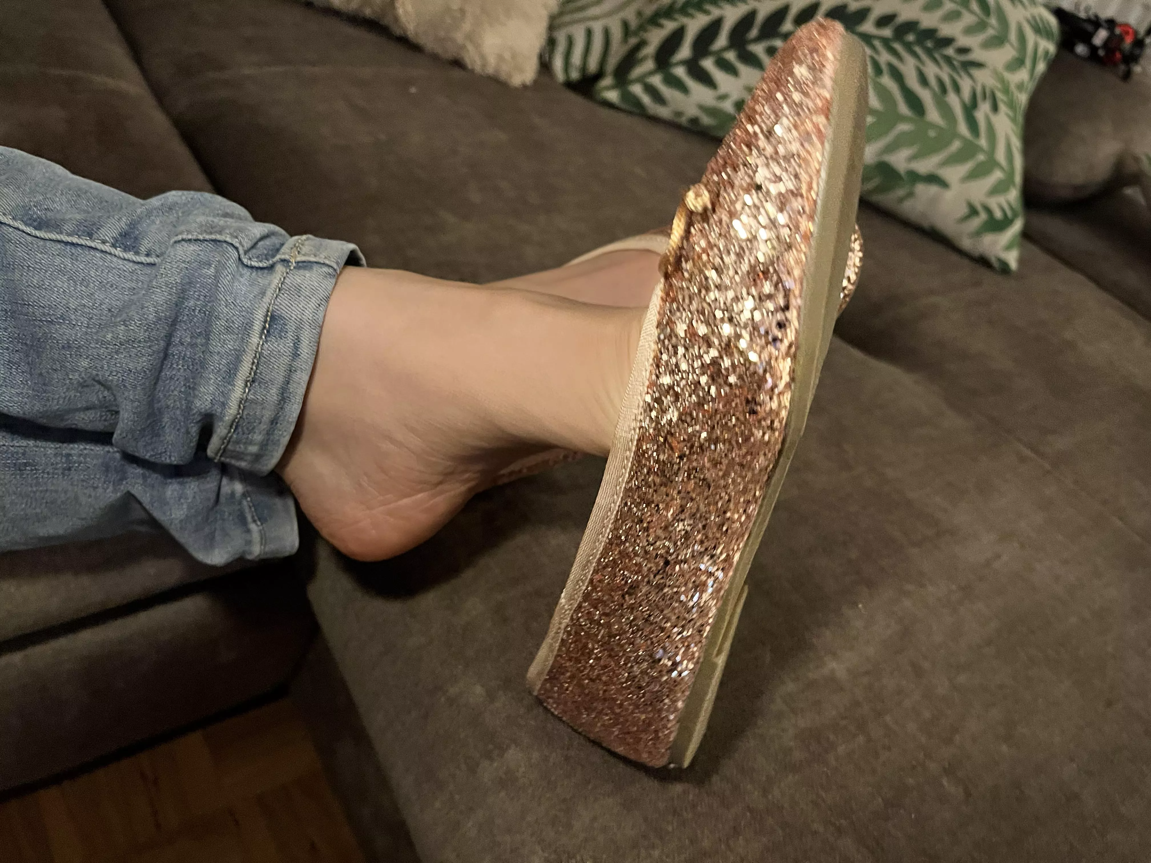 Glittering flats dangle 