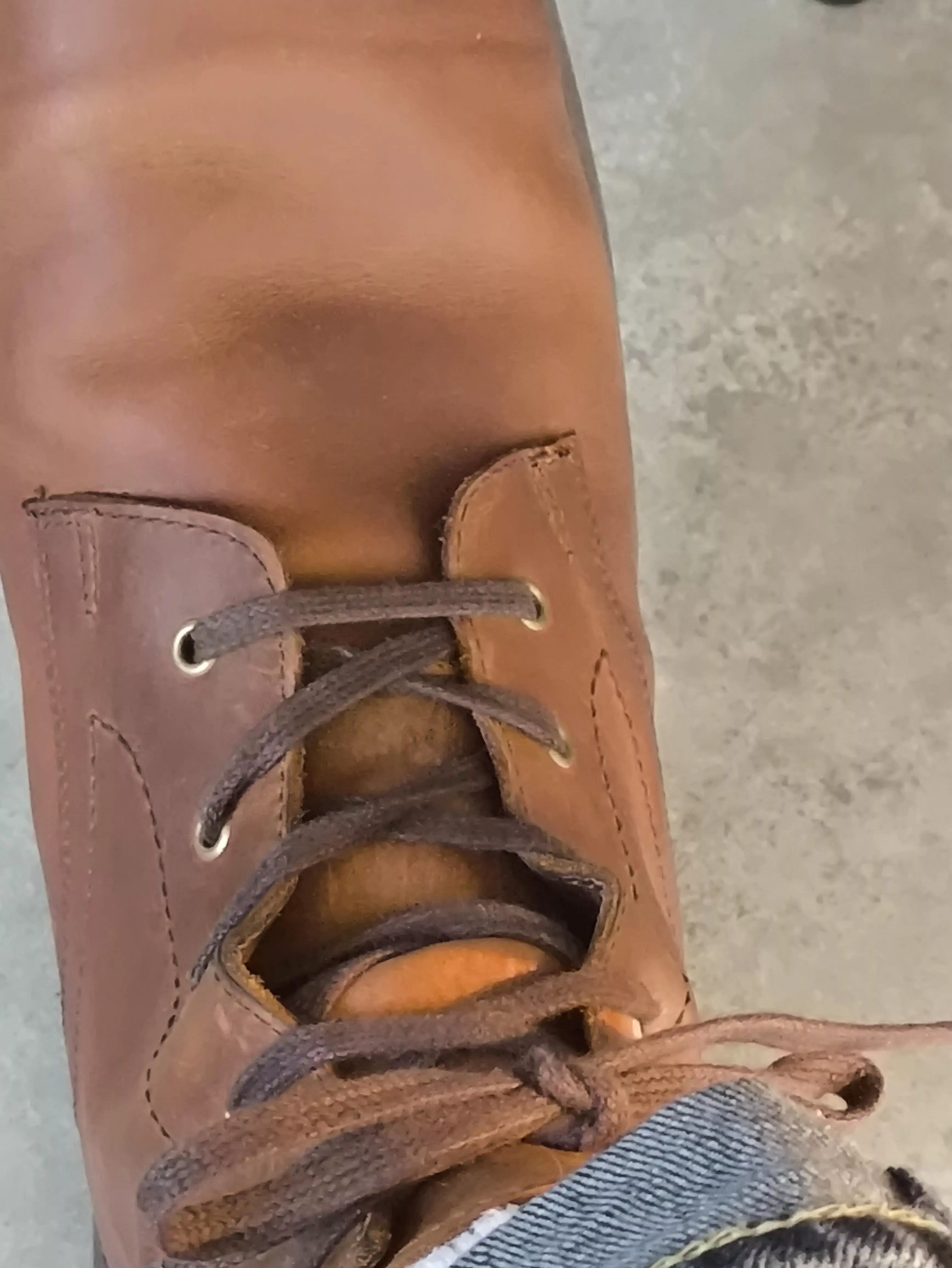 Boots open between laces in middle