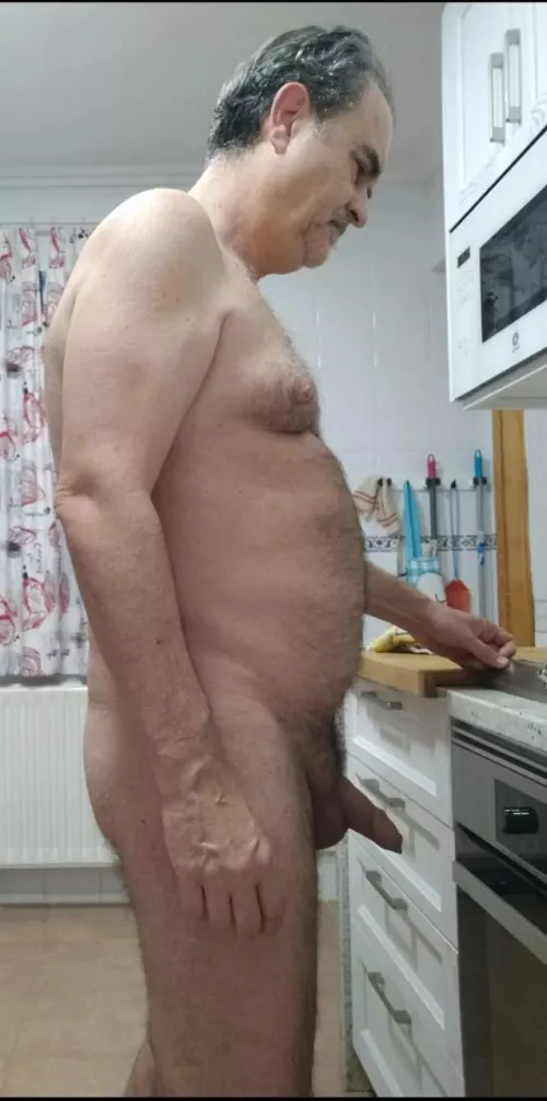 Nude at the kitchen.