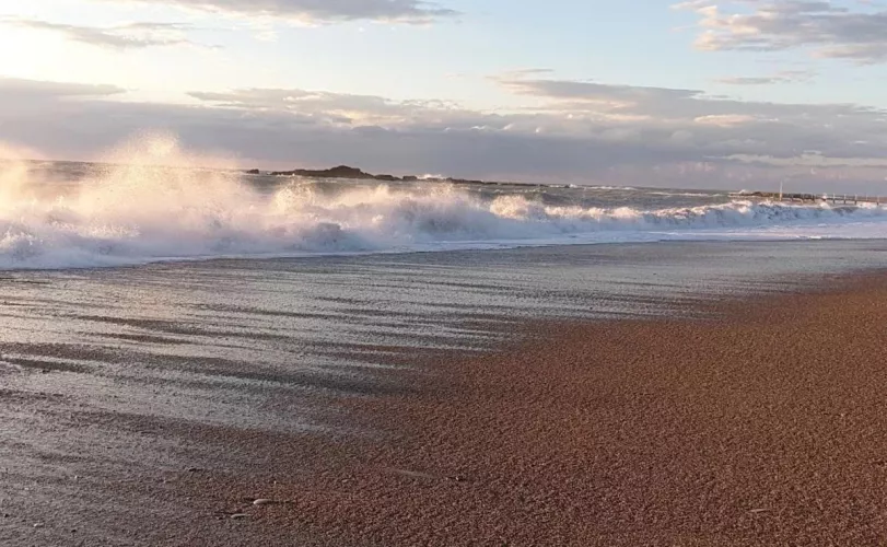 Sandy beach in Turkey and a small wave