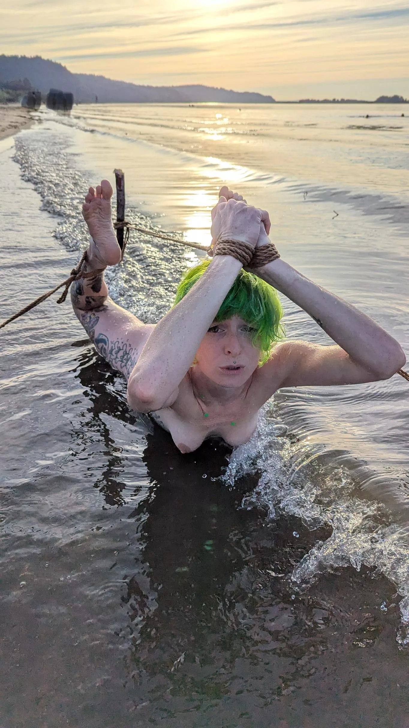 Hogtied in the frigid river 