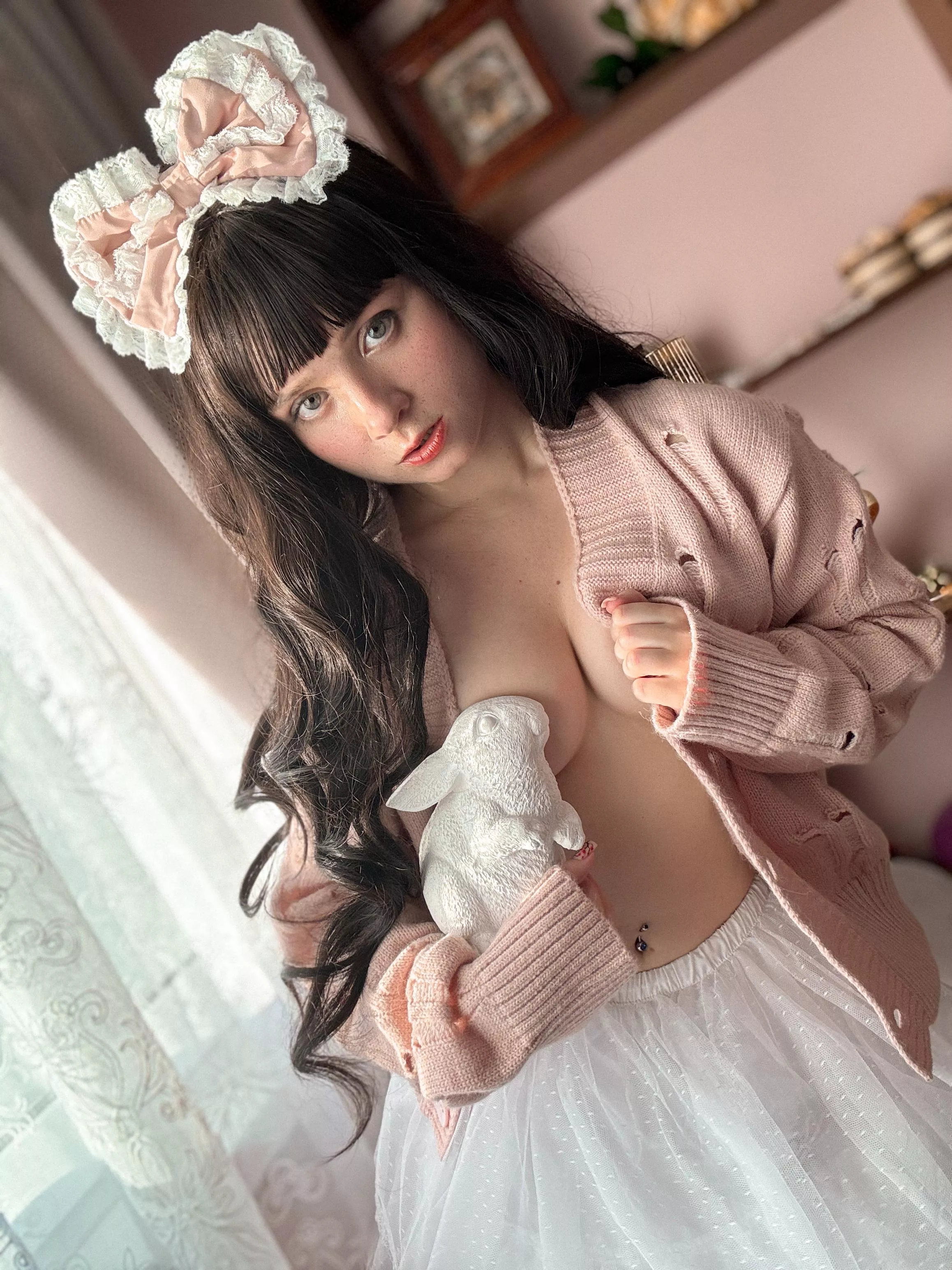 A long hair girl and a white rabbit..