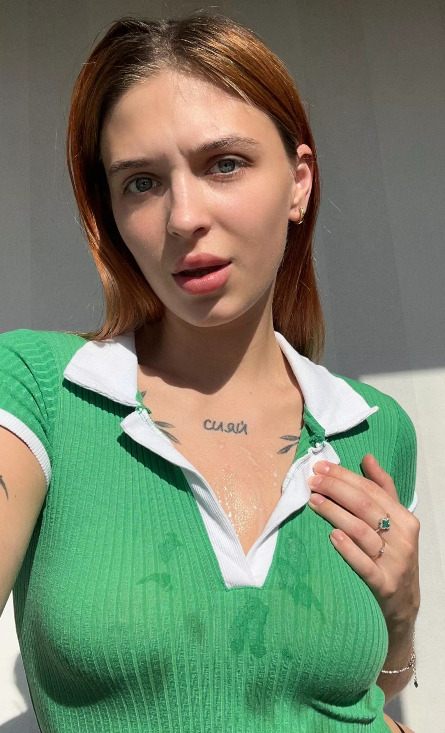 A fiery redheaded girl taking selfies