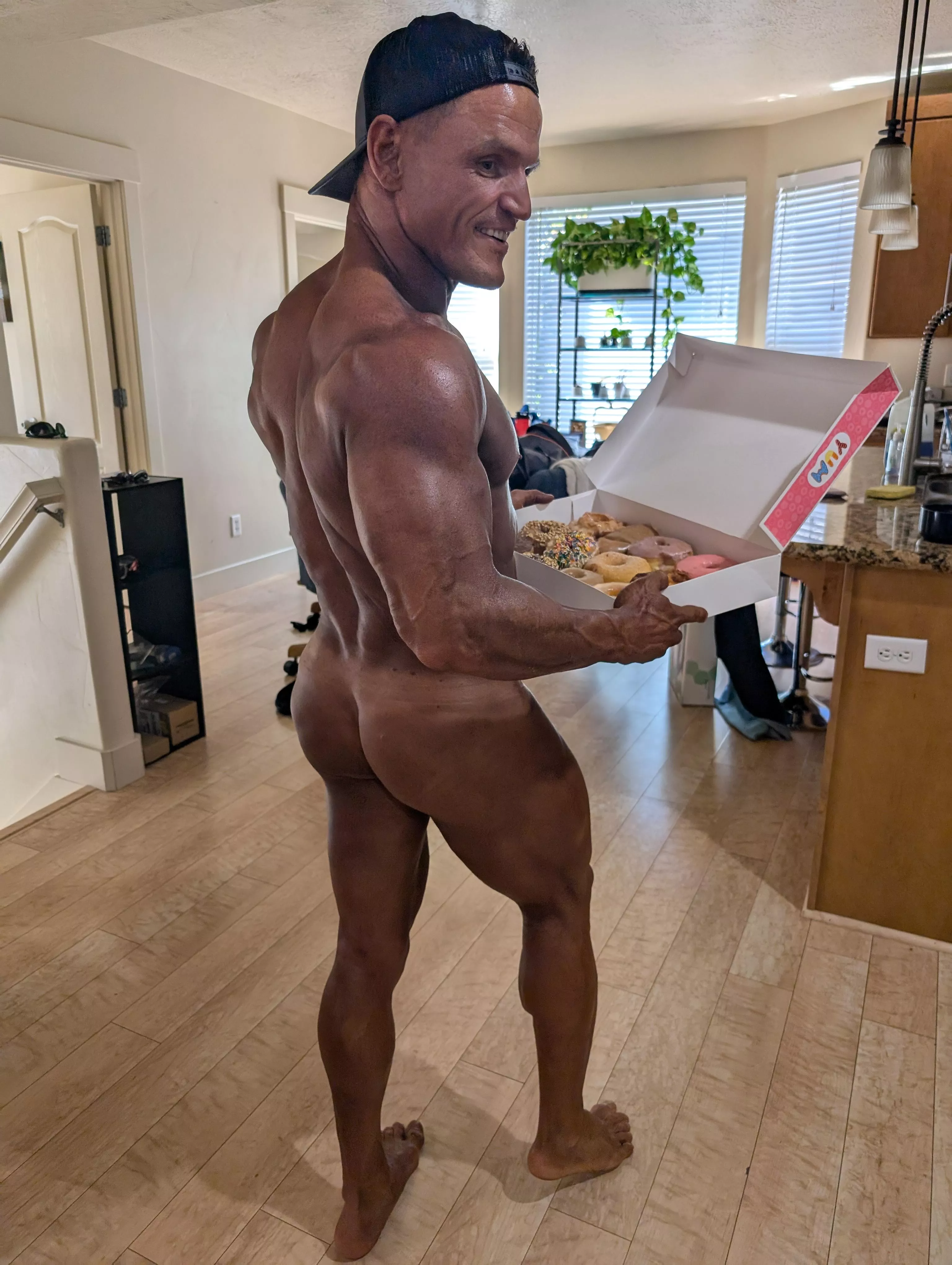 Serving up some sweet gains and a box of treats! 🍩💪 Cheat day is finally here!