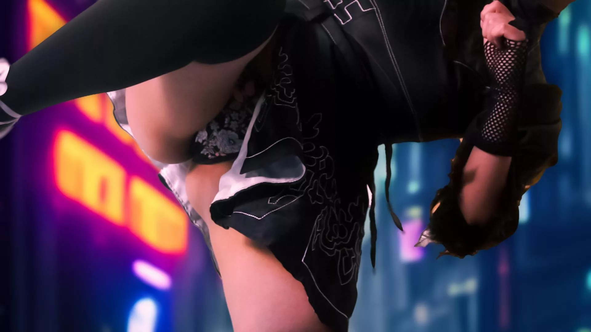  Practice some kicking with the 2B cosplay! 