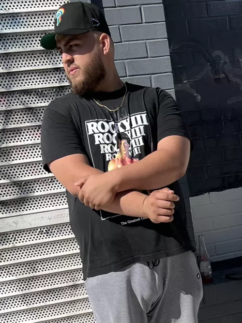 Stranger, waiting in line outside of a sports store, showing off his gigantic bulge.