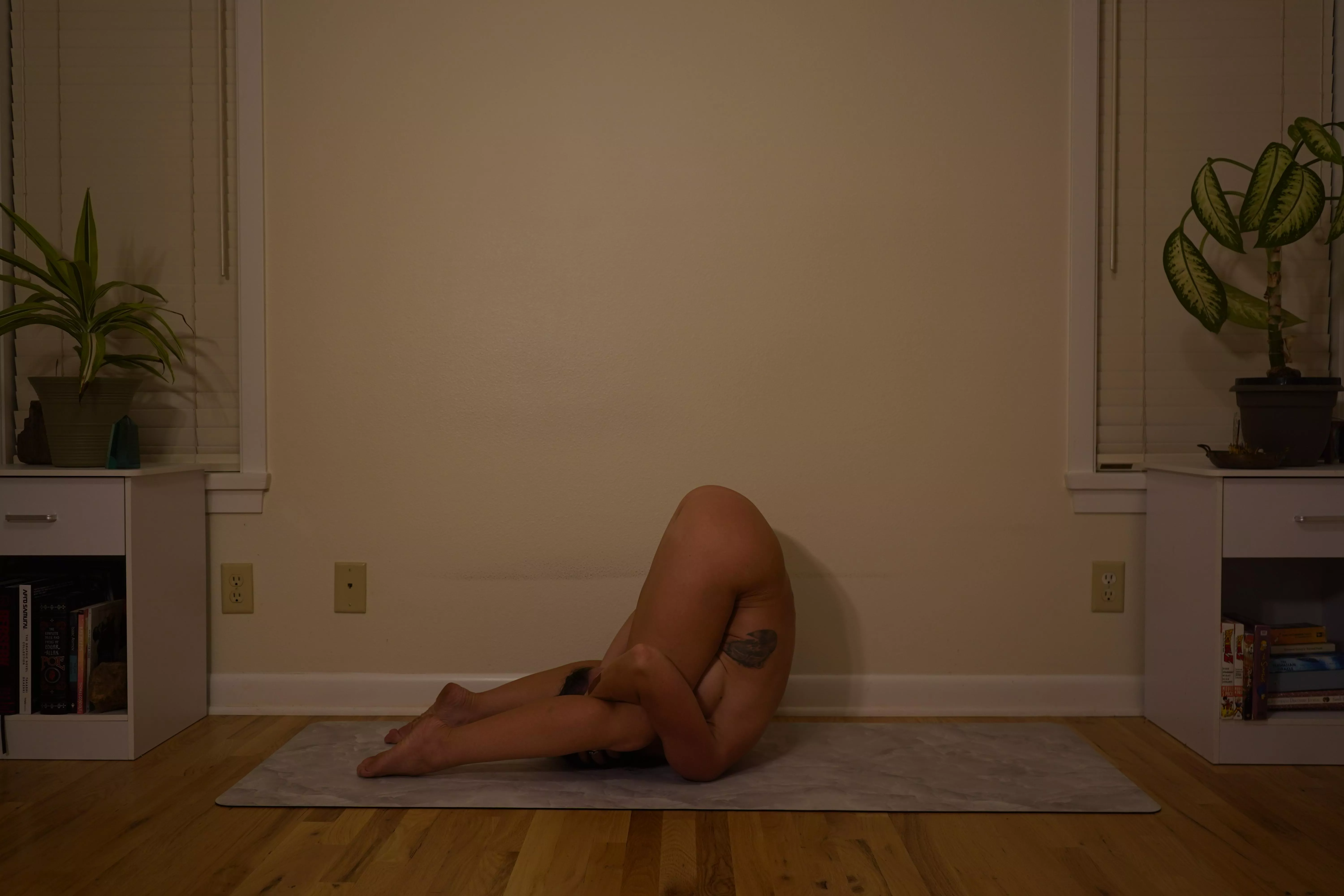karnapidasana, ear pressure pose.