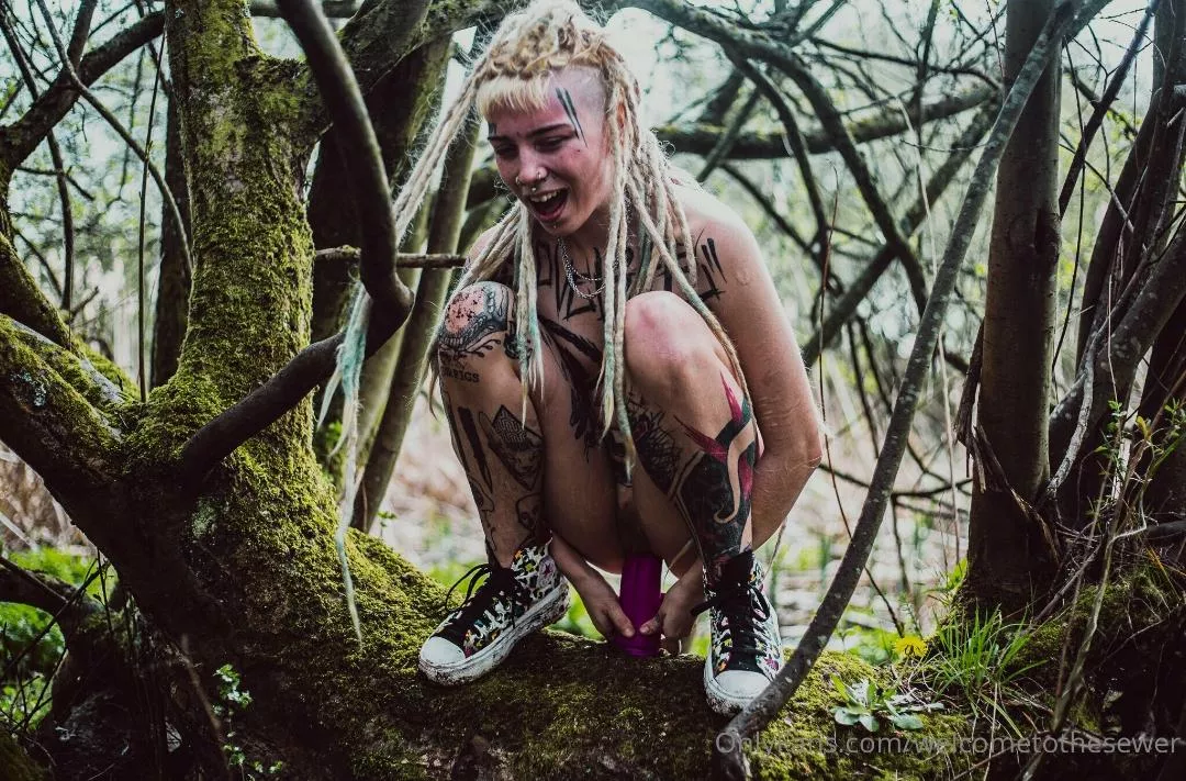 Making this dildo my bitch on this huge log just off the hiking trail