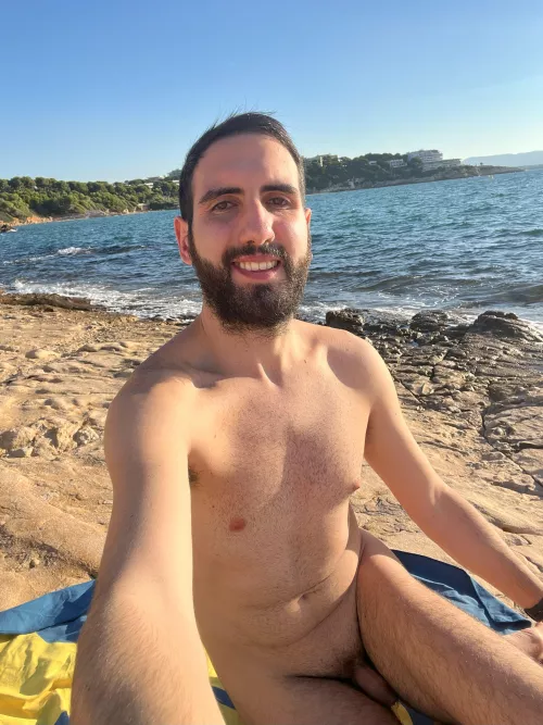 Sunbathing in the autumn sun in a Spanish cove