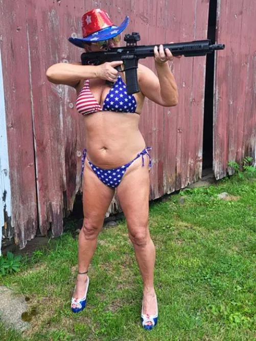 Just a conservative hottie in her patriotic bikini shooting her AR and enjoying her 2A rights !!