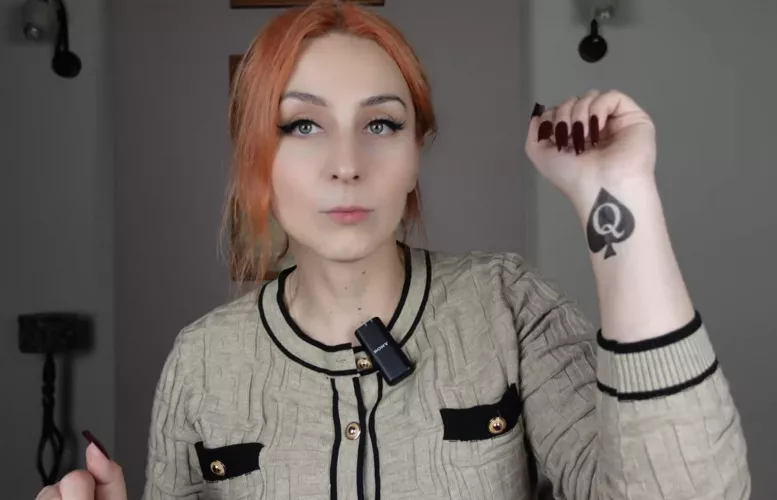 findom and luxury lifestyle mistress shows her temporary qos tattoo on her youtube video