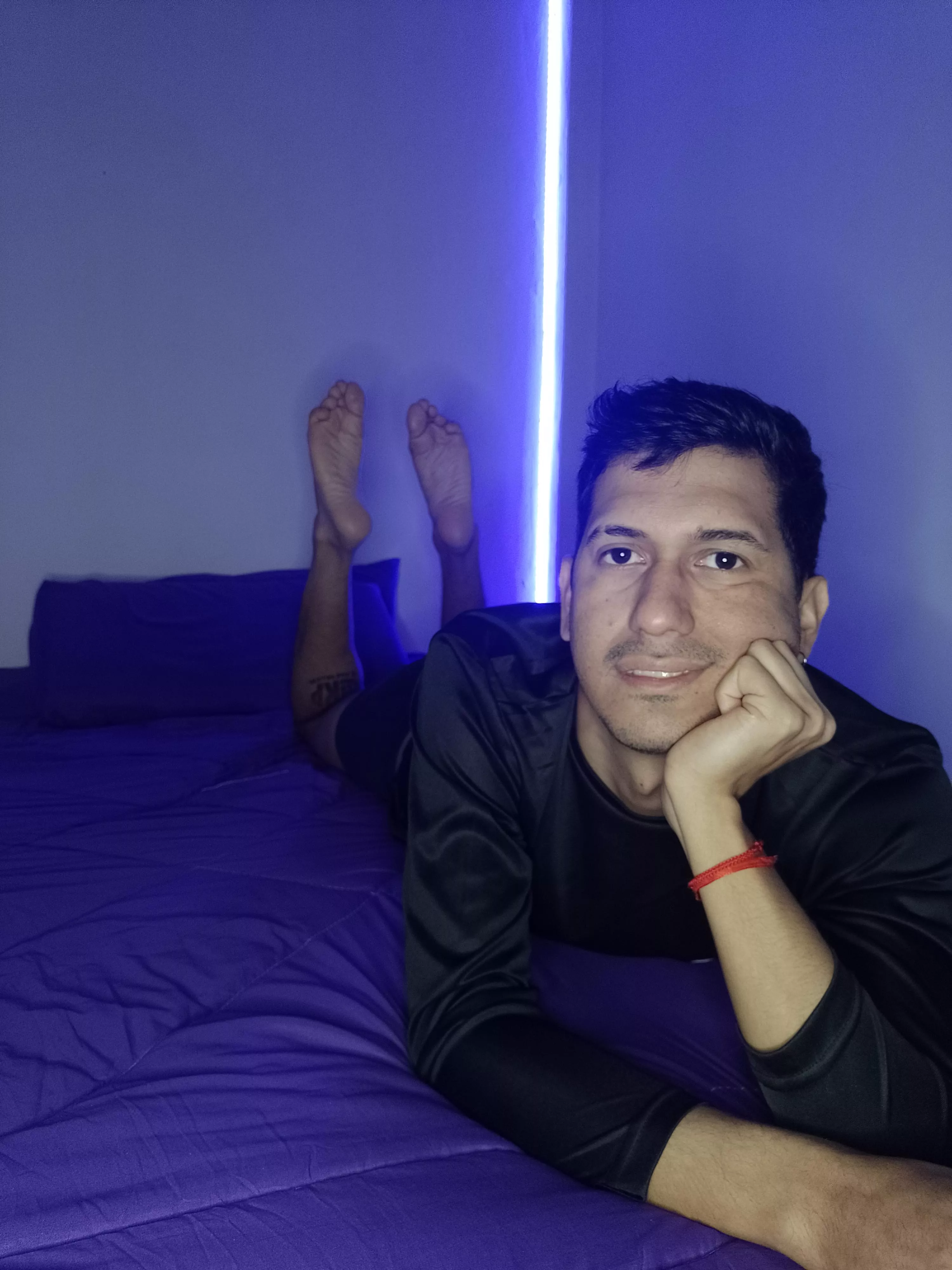 In this photo, my bare feet are firmly planted, dominating the frame as they hover just above your face.