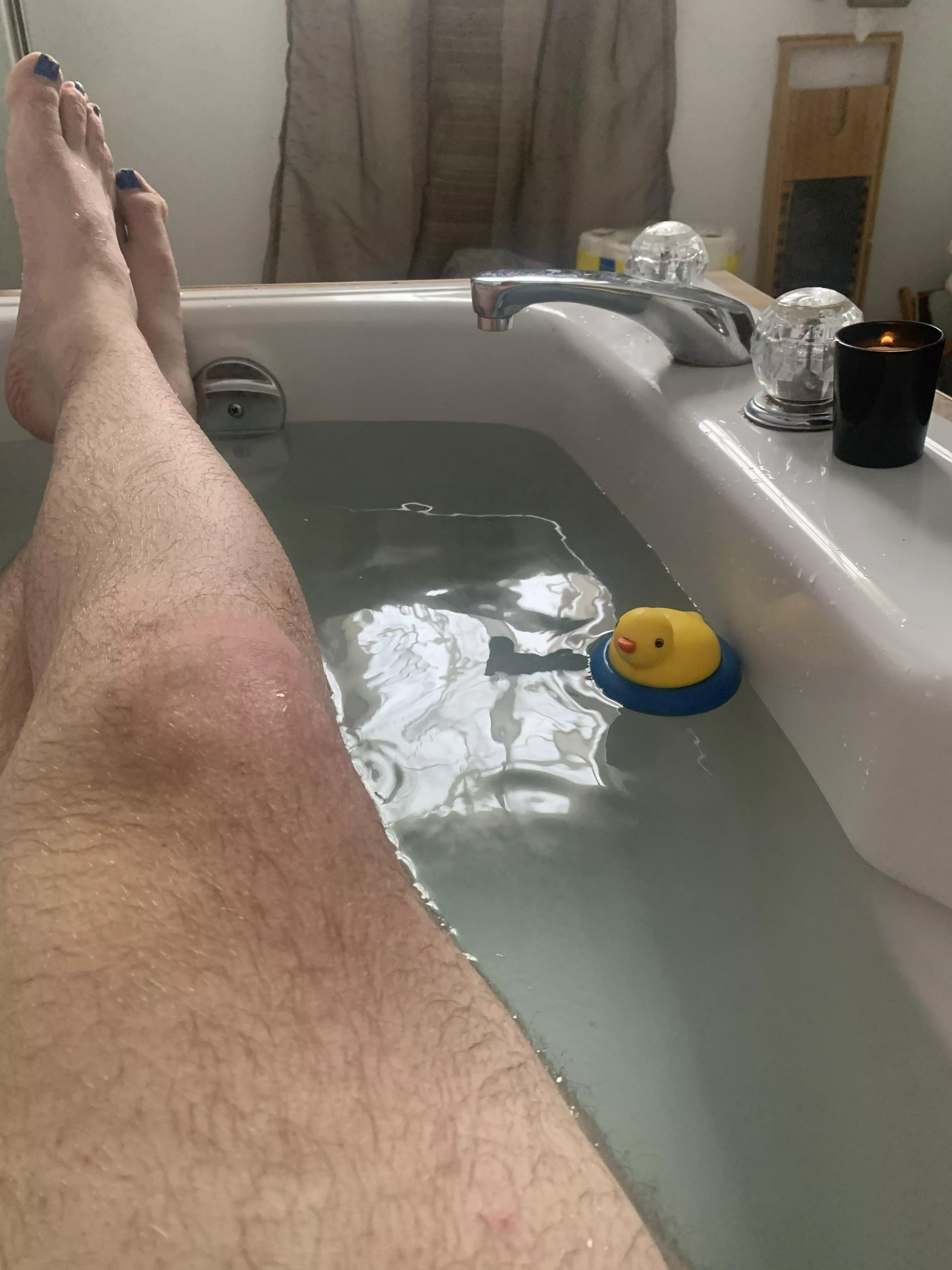 Just a man taking a bath with his duck.