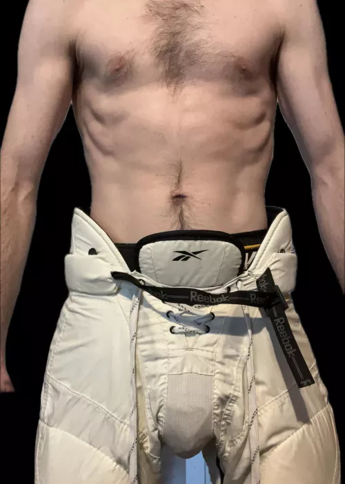 White hockey pants and goalie cup bulge