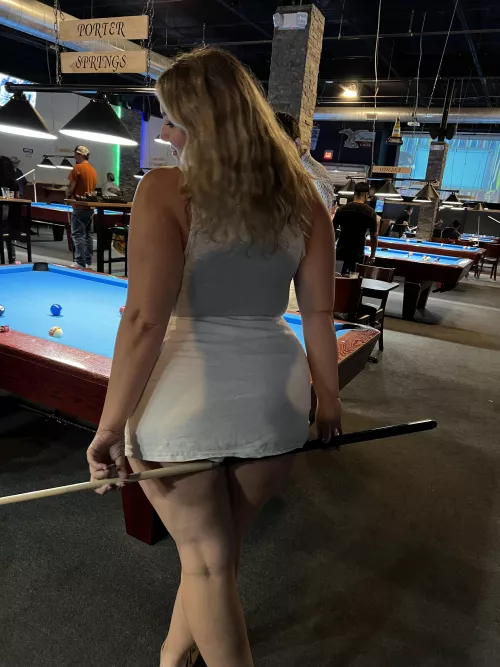Short skirt and playing pool