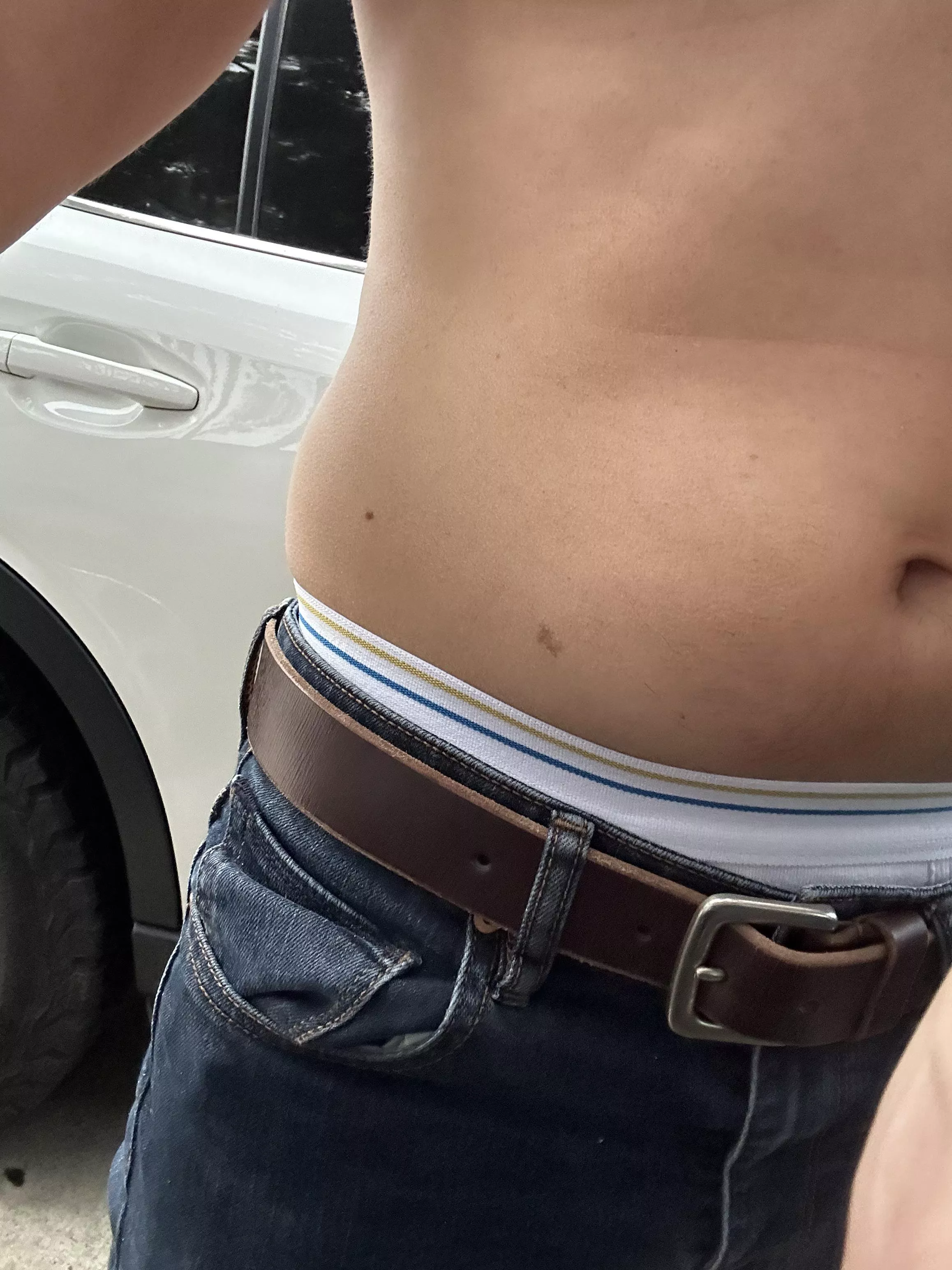 Changing in the parking lot at the beach 