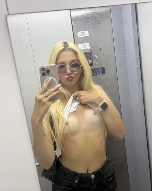 Elevator fun with tits out