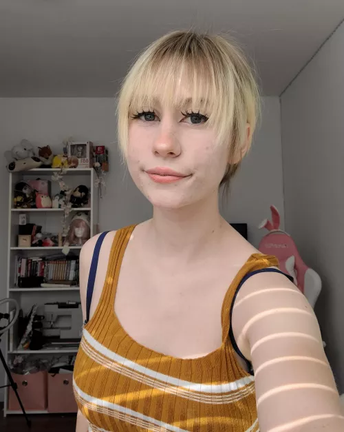 My hair's pulled back but I can assure your it's short ;D