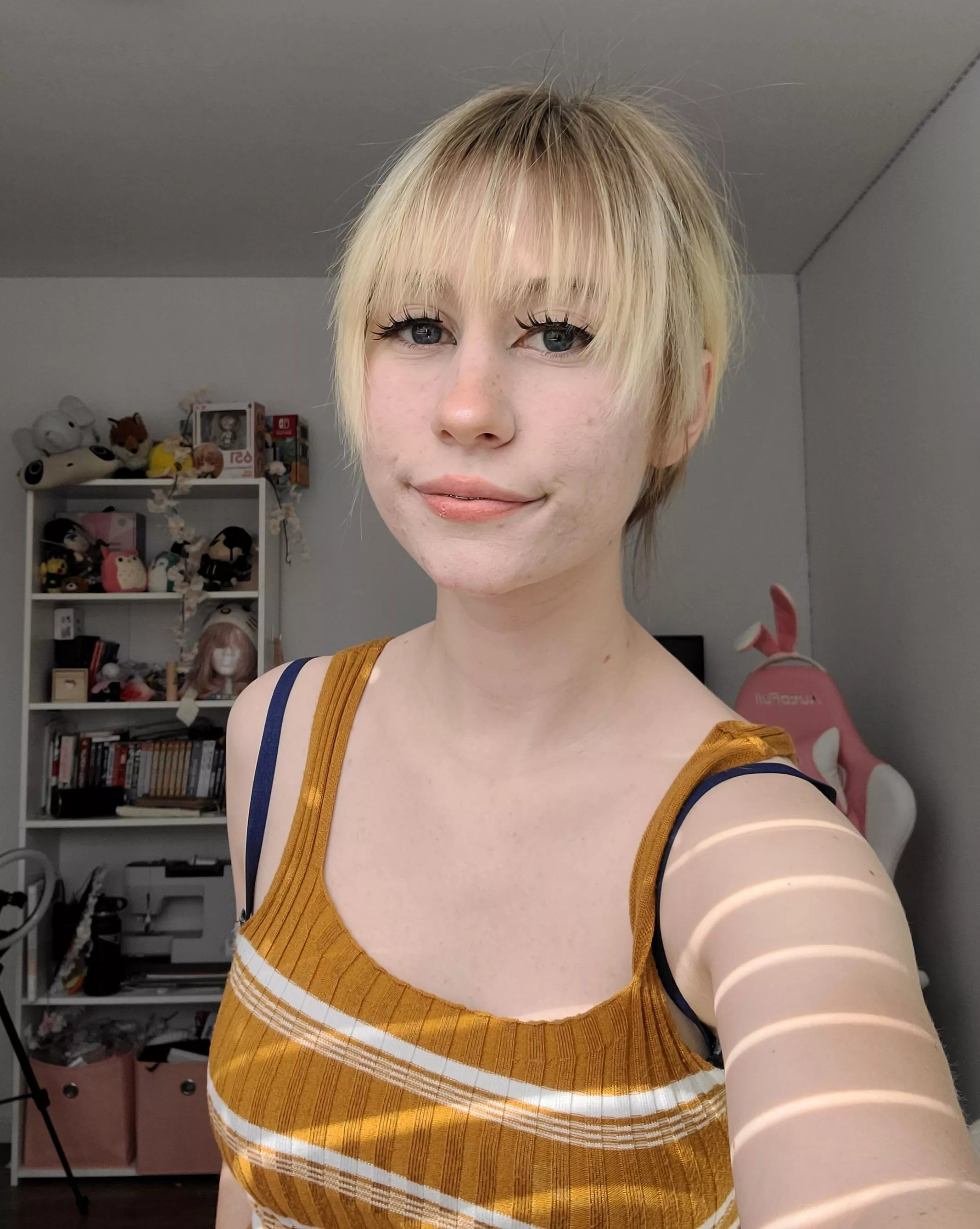 My hair's pulled back but I can assure your it's short ;D