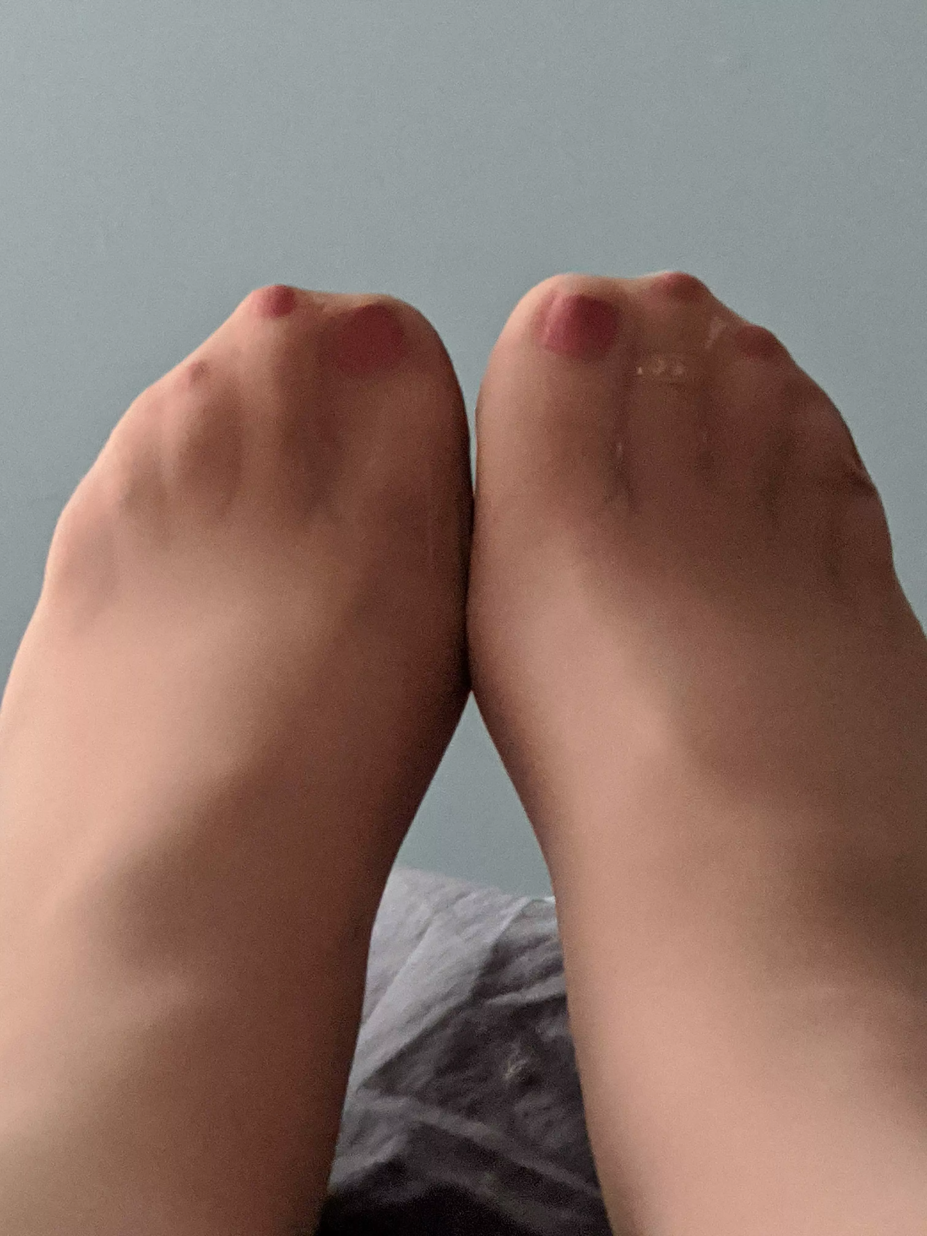 Suntan pantyhose with dark pink toe polish and toe ring - image