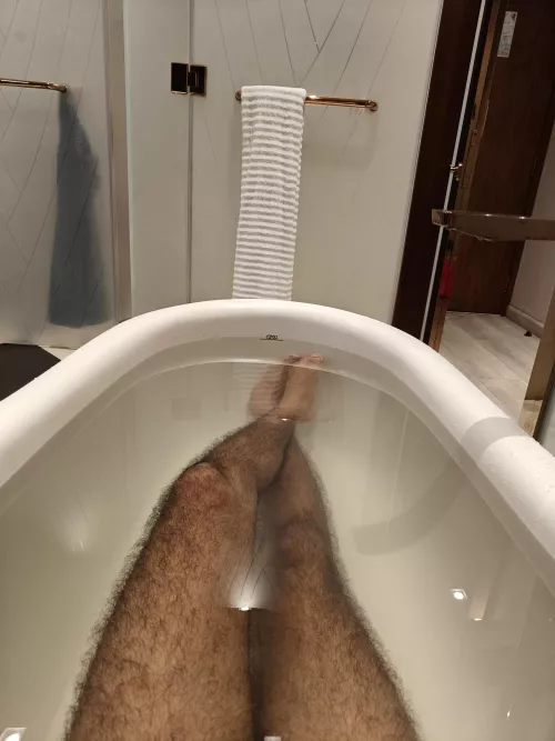 Hairy legs in bathtub. 