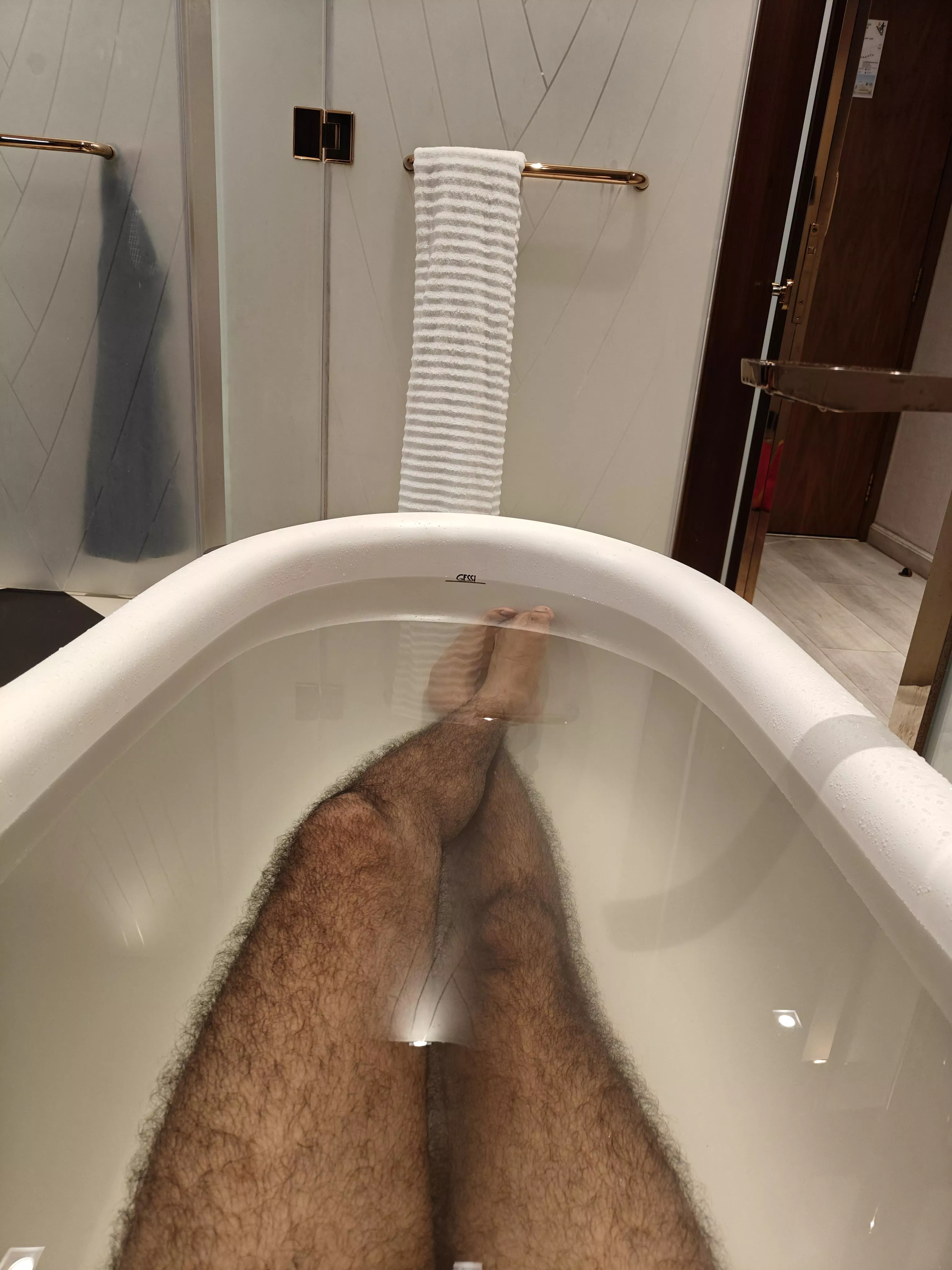 Hairy legs in bathtub. 